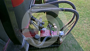 top view video of a lawnmower engine working on the golf course, motor machine job cutting grass golf course, Lawn care staff