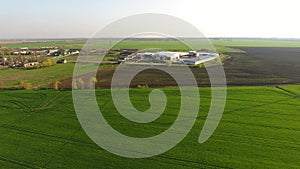 Top view of the village with houses and hangars for the storage of grain.