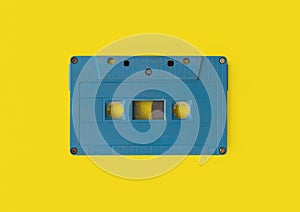 Top view of vintage audio tape cassette isolated on yellow background. 1980s recorder. Old pop music. album collection