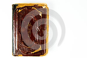 Top view on vintage book with claret leather cover with christian cross