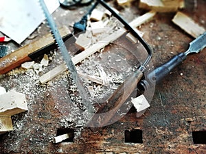 Top of view vintage old carpenter tools in a carpentry workshop, hand saw, home wood kit closeup