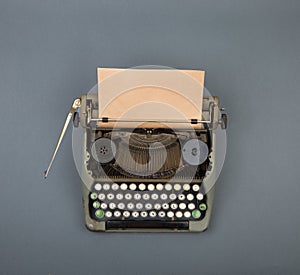 Top view of vintage typewriter on grey table