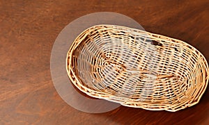 Top view of vintage weave wicker basket isolated on wood table