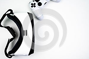 Top view of a virtual reality headset with a game controller on a white background