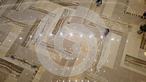 Top view of walking people in large hall