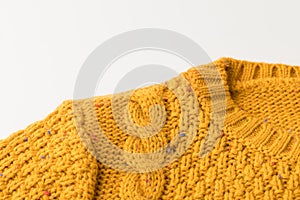 top view of warm knitted yellow sweater with pattern,