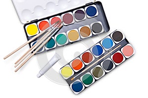 Top view of watercolor paints in box isolated on white background with clipping path