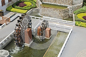 Top view of waterwheel in garden