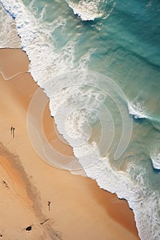 Top view of waves on sandy beach with natural patterns