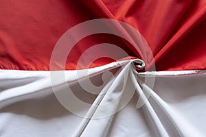 Textured Red and White Fabric Background with Elegant Folds