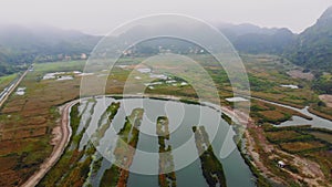 Top view of the wetlands of the island of Cat BA near the sea on land. Morning gloomy landscape of the countryside of