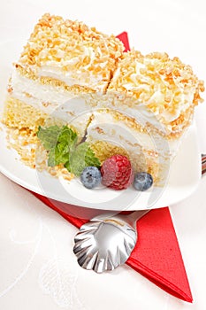 Top view of whipped cream cake garnished with berries