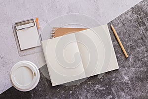 Top view white binder blank notebook or diary or journal for writing text and message with pencil and coffee cup on concrete