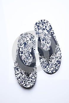 Top View of White and Blue Camouflage Flip Flops On White Background