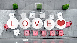 Top view of white circle table and chairs at outdoor with word