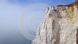 Top view of white cliff with arch. Action. Arched passage in white cliff - beautiful miracle of nature, created in