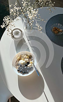 Top view of white dinning table with cereal for breakfast