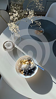 Top view of white dinning table with cereal for breakfast