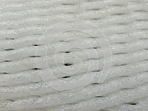 Top view of white fruit foam net. Use for protect fruit. Texture abstract background.