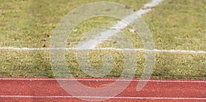 Top view of white horizontal stripe on the artificial soccer field