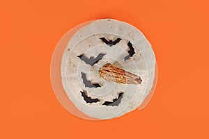 Top view of white Japanese Hokkaido quash with bats on orange background