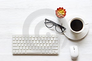 Top view of white office desk table with a lot of supply office on it.