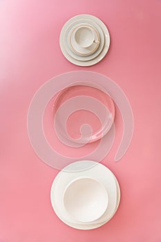 Top view of white and pink dishware.