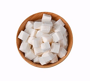 Top view of white pure sugar cubes in wooden bowl isolated on white background