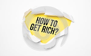 Top view of white torn paper and the text how to get rich on a yellow background