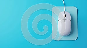 Top view of wired mouse on mousepad with blue background