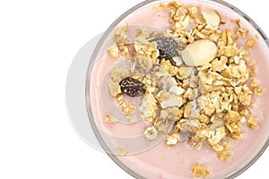 Top view wholegrain muesli on top of strawberry flavor yogurt