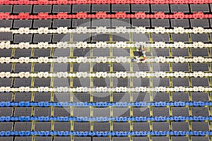 Top view and wide shot of two technician workers set up or install solar cell panel over the water reservoir as solar farm factory