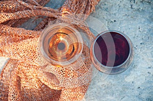 Top view on wineglasses with red, white wine on stone