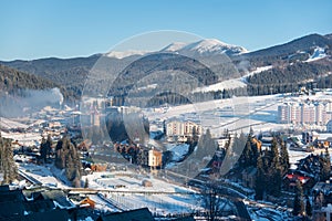 Top view winter landscape of a little town near mountains