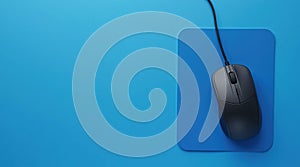 Top view of wired mouse on a blue mouse pad background