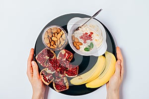 Top view woman hands holding plate