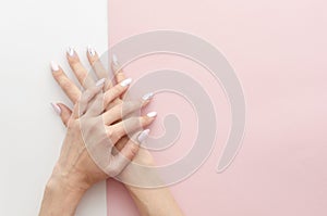 Top view woman`s hands manicure with nail painting work. Drawing on nails banner concept for a beauty salon with copy