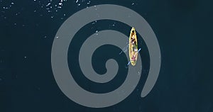 Top view on woman sun tanning on kayak