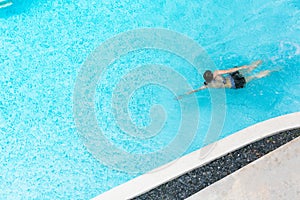 Top view of a woman in the swimming pool. relax time