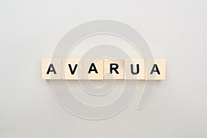 Top view of wooden blocks with Avarua lettering on grey background.