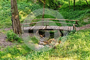 Top view wooden bridge over small river