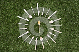 Top view of wooden spoons with forks and knives