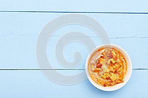 Top view on wooden table with vegetables salad or soup. Blank place for copy space