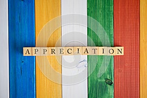 Top view of the word Appreciation spelled on wooden cubes