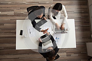 Top view of worker giving high five to colleague