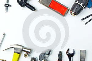 Top view of Working tools,wrench,socket wrench,hammer,screwdriver,plier,electric drill,tape measure,machinist square and safety g