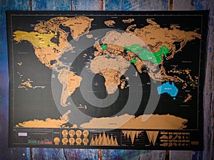 Top view world map on a blue wooden