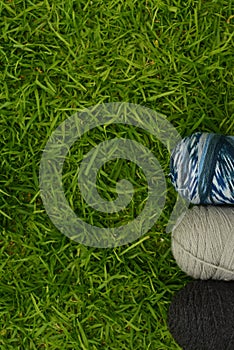 Top view of worsted yarn on the grass photo