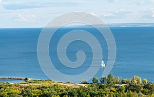 Top view a yacht with white sails sails
