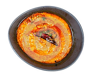 Top view of yellow Dal Tadka in bowl isolated